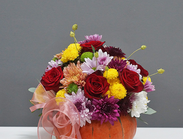 Arrangement with Red Roses and Chrysanthemum in a Pumpkin photo